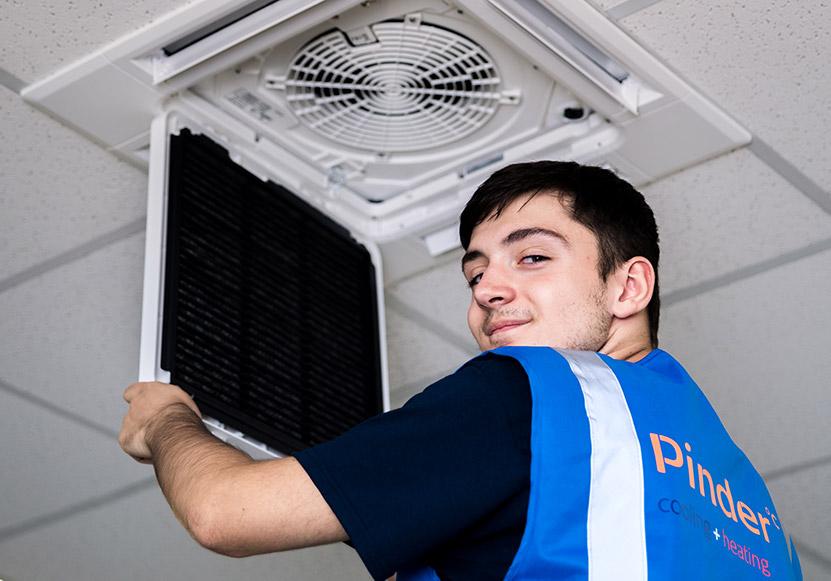 Pinder engineer installing air conditioning system