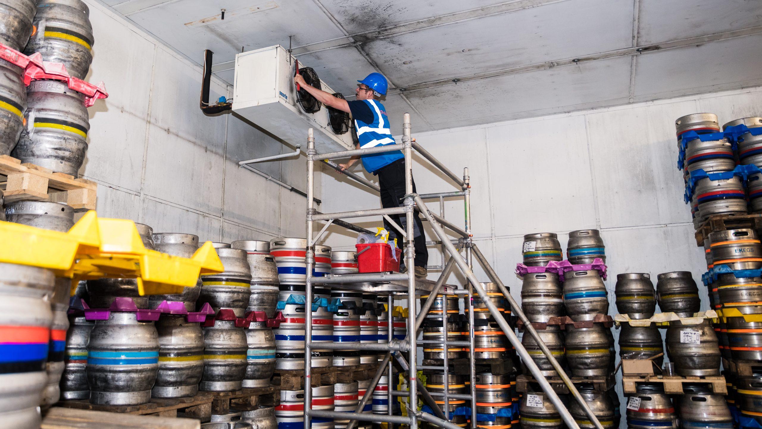 Cellar cooling not working? Cellar cooling technician working on cooling unit.